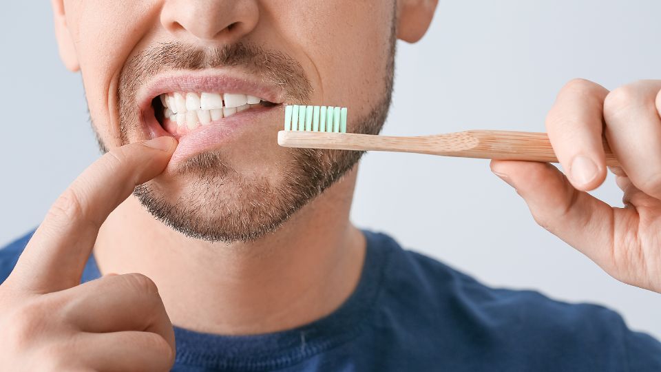 when can i brush my teeth after tooth extraction