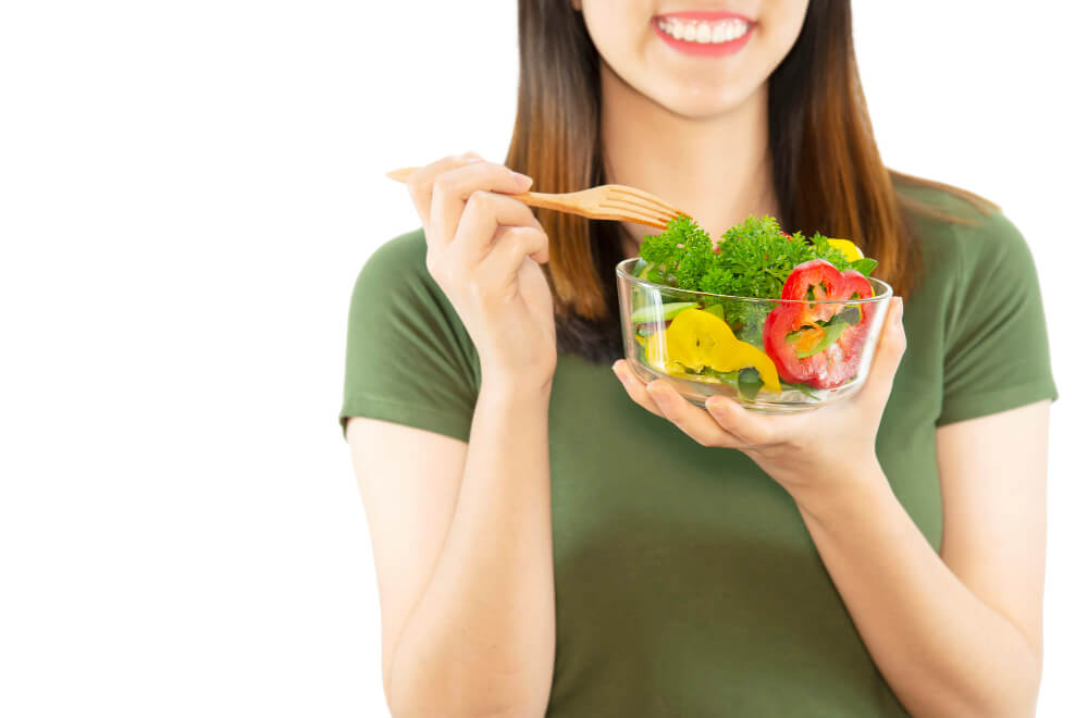 happy lady enjoy eating vegetable salad